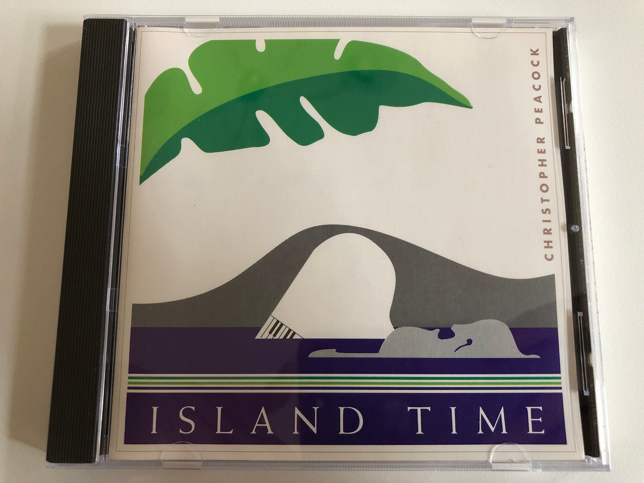 https://cdn10.bigcommerce.com/s-62bdpkt7pb/products/0/images/187181/Christopher_Peacock_Island_Time_Pure_Simple_Music_Audio_CD_1989_PS-9001_1__83640.1628744773.1280.1280.JPG?c=2&_gl=1*1iye474*_ga*MjA2NTIxMjE2MC4xNTkwNTEyNTMy*_ga_WS2VZYPC6G*MTYyODc0Mzc3MS4yOS4xLjE2Mjg3NDQ4NDIuNjA.