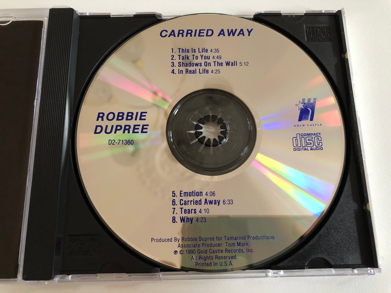 https://cdn10.bigcommerce.com/s-62bdpkt7pb/products/0/images/187192/Robbie_Dupree_Carried_Away_Gold_Castle_Audio_CD_1990_D2-71360_3__15243.1628745319.1280.1280.JPG?c=2&_gl=1*12e0nd4*_ga*MjA2NTIxMjE2MC4xNTkwNTEyNTMy*_ga_WS2VZYPC6G*MTYyODc0Mzc3MS4yOS4xLjE2Mjg3NDUyMDguNDI.