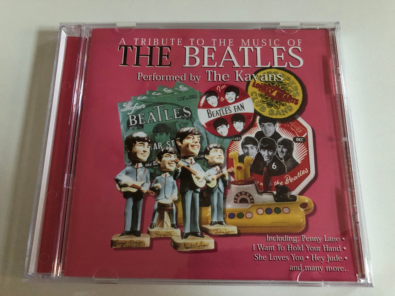 https://cdn10.bigcommerce.com/s-62bdpkt7pb/products/0/images/187394/A_Tribute_To_The_Music_Of_The_Beatles_-_Performed_by_The_Kavans_Including_Penny_Lane_I_Want_To_Hold_Your_Hand_She_Loves_You_Hey_Jude_and_many_more_Cosmopolitan_Audio_CD_2000_40577-2_1__06773.1628830083.1280.1280.JPG?c=2&_gl=1*1nfzv71*_ga*MjA2NTIxMjE2MC4xNTkwNTEyNTMy*_ga_WS2VZYPC6G*MTYyODgyOTg2OC4zMS4xLjE2Mjg4MzAxOTkuNjA.