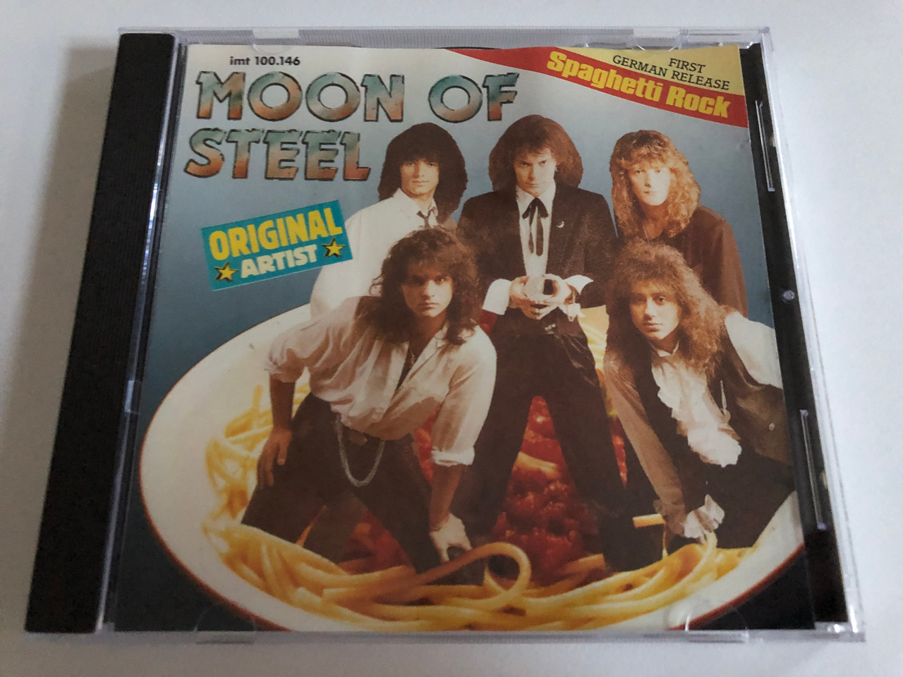 https://cdn10.bigcommerce.com/s-62bdpkt7pb/products/0/images/187429/Moon_Of_Steel_Spaghetti_Rock_Vivo_Audio_CD_1990_Stereo_imt_100_1__79910.1628831966.1280.1280.JPG?c=2&_gl=1*pmhpq0*_ga*MjA2NTIxMjE2MC4xNTkwNTEyNTMy*_ga_WS2VZYPC6G*MTYyODgyOTg2OC4zMS4xLjE2Mjg4MzE4NjMuMzI.