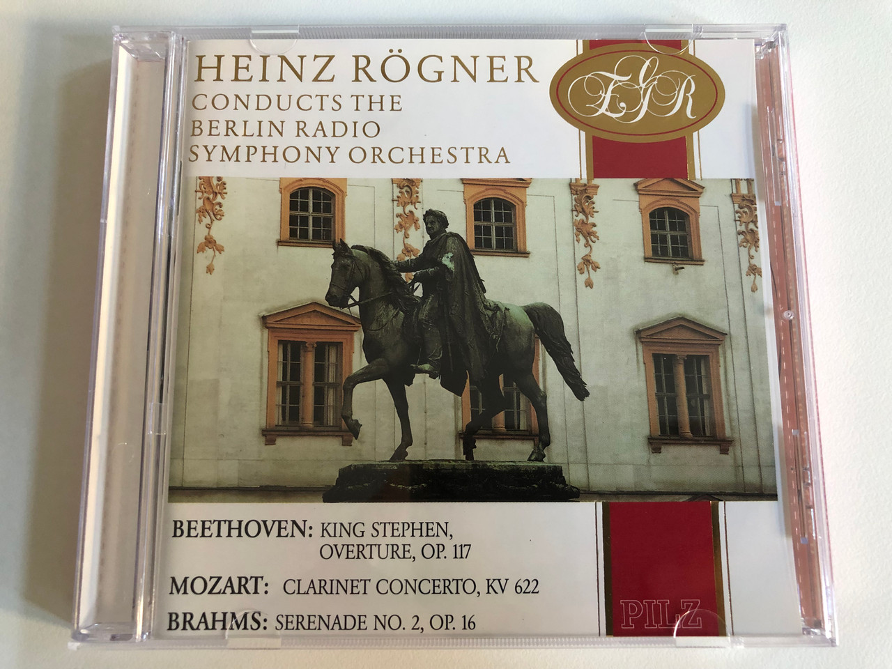 https://cdn10.bigcommerce.com/s-62bdpkt7pb/products/0/images/188310/Heinz_Rgner_Conducts_The_Berlin_Radio_Symphony_Orchestra_Beethoven_King_Stephen_Overture_Op._117_Mozart_Clarinet_Concerto_KV_622_Brahms_Serenade_No._2_Op._16_Pilz_Audio_CD_1990_Stere_1__58562.1629391995.1280.1280.JPG?c=2&_gl=1*1lsnmmy*_ga*MjA2NTIxMjE2MC4xNTkwNTEyNTMy*_ga_WS2VZYPC6G*MTYyOTM4MjA0Mi4zOS4xLjE2MjkzOTE3ODIuNjA.