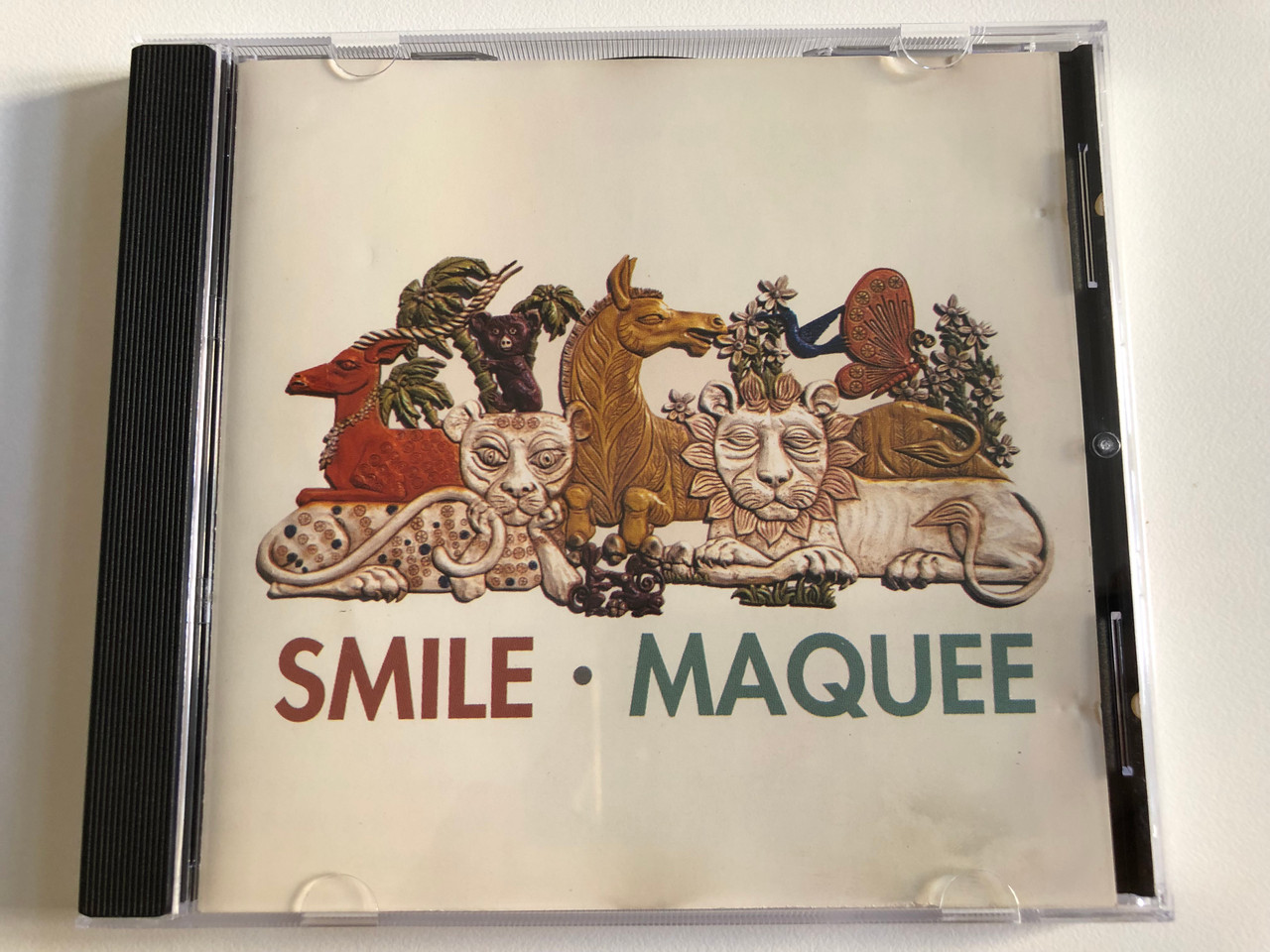 https://cdn10.bigcommerce.com/s-62bdpkt7pb/products/0/images/188580/Smile_Maquee_Atlantic_Audio_CD_1995_7567-82769-2_1__31802.1629702107.1280.1280.JPG?c=2&_gl=1*1446l18*_ga*MjA2NTIxMjE2MC4xNTkwNTEyNTMy*_ga_WS2VZYPC6G*MTYyOTY5NzY5MS40MS4xLjE2Mjk3MDE5NjIuNTk.