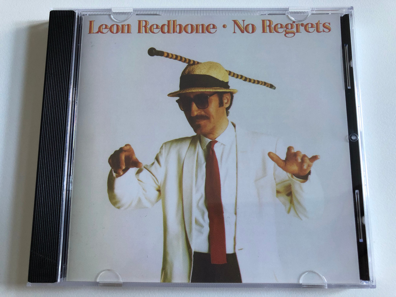 https://cdn10.bigcommerce.com/s-62bdpkt7pb/products/0/images/188747/Leon_Redbone_No_Regrets_Blue_Thumb_Records_Audio_CD_549_766-2_1__34321.1629786227.1280.1280.JPG?c=2&_gl=1*166rvuf*_ga*MjA2NTIxMjE2MC4xNTkwNTEyNTMy*_ga_WS2VZYPC6G*MTYyOTc4NDA0NC40Mi4xLjE2Mjk3ODU5NzUuNTg.