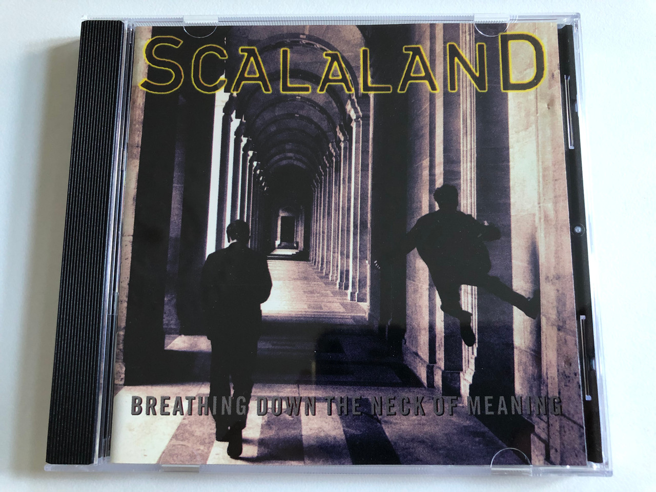 https://cdn10.bigcommerce.com/s-62bdpkt7pb/products/0/images/188753/Scalaland_Breathing_Down_The_Neck_Of_Meaning_Mother_Records_Audio_CD_1995_527_342-2_1__42373.1629786590.1280.1280.JPG?c=2&_gl=1*1e2f7gv*_ga*MjA2NTIxMjE2MC4xNTkwNTEyNTMy*_ga_WS2VZYPC6G*MTYyOTc4NDA0NC40Mi4xLjE2Mjk3ODY0NTYuNDM.