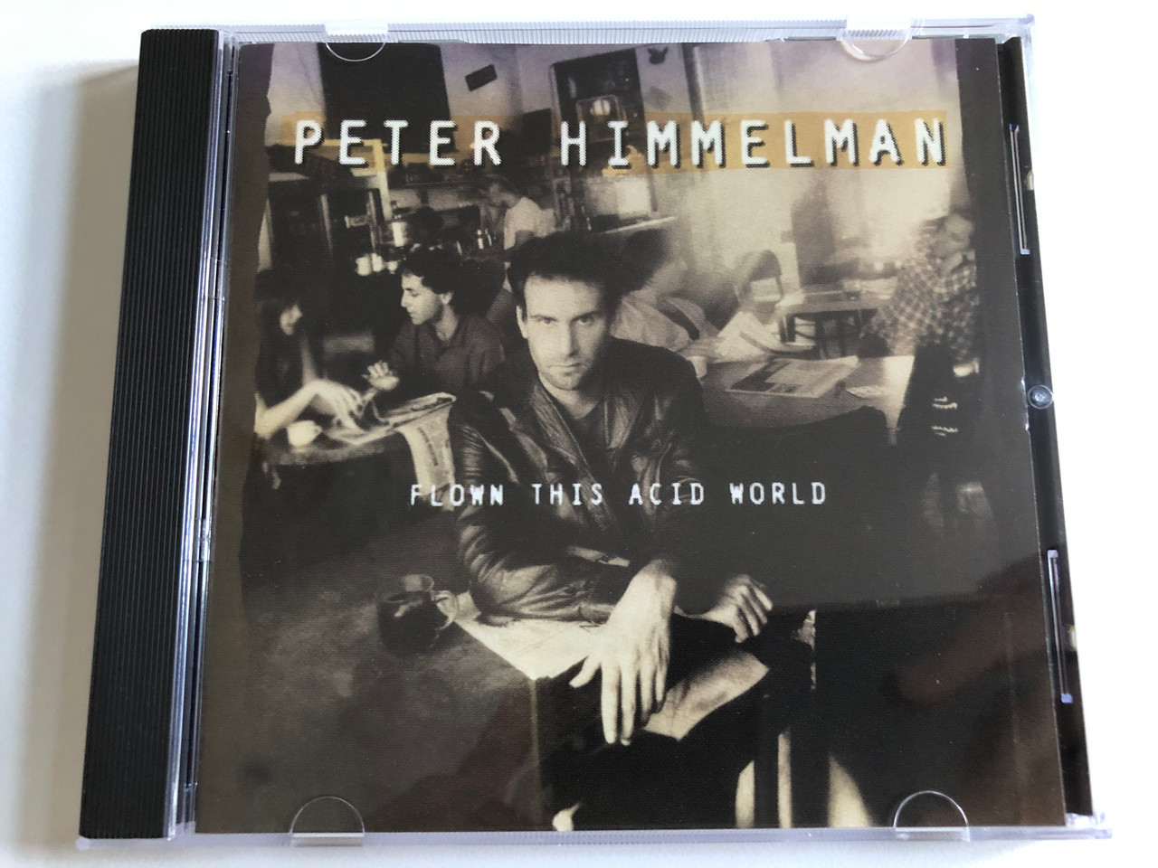 https://cdn10.bigcommerce.com/s-62bdpkt7pb/products/0/images/188757/Peter_Himmelman_Flown_This_Acid_World_Epic_Audio_CD_1992_EK_52588_1__74993.1629786858.1280.1280.JPG?c=2&_gl=1*1f98sku*_ga*MjA2NTIxMjE2MC4xNTkwNTEyNTMy*_ga_WS2VZYPC6G*MTYyOTc4NDA0NC40Mi4xLjE2Mjk3ODY5ODkuNjA.