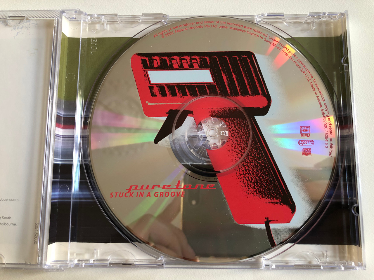 https://cdn10.bigcommerce.com/s-62bdpkt7pb/products/0/images/189077/Puretone_Stuck_In_A_Groove_Illustrious_Audio_CD_2003_ILLLP003_3__96040.1629954338.1280.1280.JPG?c=2&_gl=1*nn3ymi*_ga*MjA2NTIxMjE2MC4xNTkwNTEyNTMy*_ga_WS2VZYPC6G*MTYyOTk1NDA0My40Ni4wLjE2Mjk5NTQwNDMuNjA.