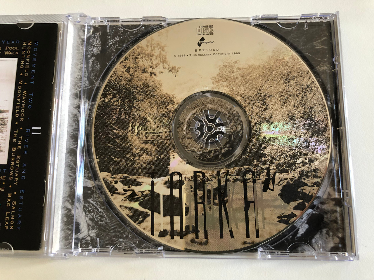 https://cdn10.bigcommerce.com/s-62bdpkt7pb/products/0/images/189338/Anthony_Phillips_Harry_Williamson_Tarka_Music_Inspired_By_Henry_Williamsons_Novel_Tarka_The_Otter_Blueprint_Audio_CD_1996_BP219CD_3__59352.1630045000.1280.1280.JPG?c=2&_gl=1*4flanb*_ga*MjA2NTIxMjE2MC4xNTkwNTEyNTMy*_ga_WS2VZYPC6G*MTYzMDA0MDQ4Mi40OC4xLjE2MzAwNDQ4NjMuNDE.
