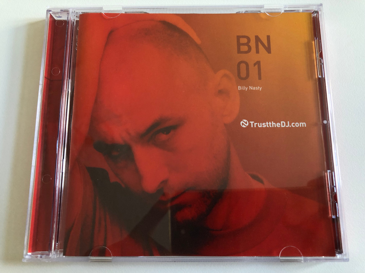 https://cdn10.bigcommerce.com/s-62bdpkt7pb/products/0/images/189359/BN01_-_Billy_Nasty_Trust_The_DJ_Audio_CD_2002_TTDJCS_018_1__66510.1630048120.1280.1280.JPG?c=2&_gl=1*5sdr71*_ga*MjA2NTIxMjE2MC4xNTkwNTEyNTMy*_ga_WS2VZYPC6G*MTYzMDA0MDQ4Mi40OC4xLjE2MzAwNDc3MTYuNDA.