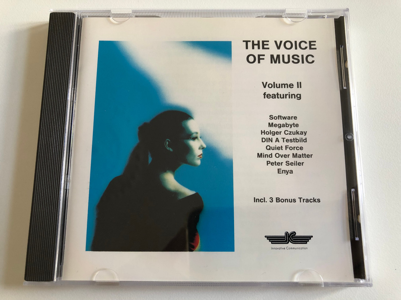 https://cdn10.bigcommerce.com/s-62bdpkt7pb/products/0/images/189363/The_Voice_Of_Music_-_Volume_II_-_Featuring_Software_Megabyte_Holger_Czukay_Din_A_Testbild_Quiet_Force_Mind_Over_Matter_Peter_Seiler_Enya_Innovative_Communication_Audio_CD_1989_Stereo_1__45255.1630056717.1280.1280.JPG?c=2&_gl=1*zu9sol*_ga*MjA2NTIxMjE2MC4xNTkwNTEyNTMy*_ga_WS2VZYPC6G*MTYzMDA1NjUyMS40OS4xLjE2MzAwNTY2ODguNjA.