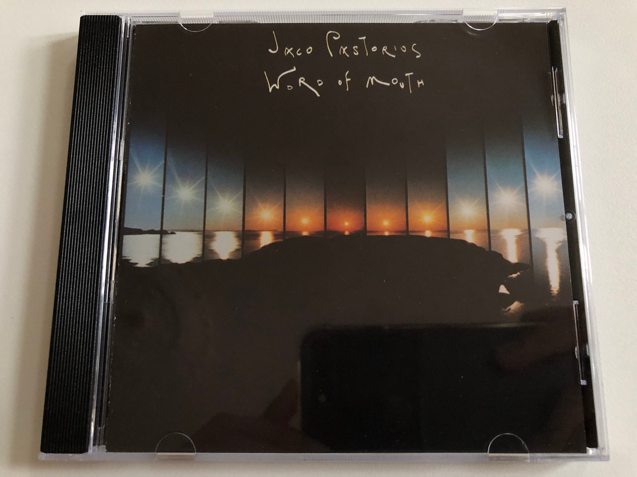 https://cdn10.bigcommerce.com/s-62bdpkt7pb/products/0/images/189600/Jaco_Pastorius_Word_Of_Mouth_Warner_Bros._Records_Audio_CD_1990_7599-23525-2_1__76037.1630351345.1280.1280.JPG?c=2&_gl=1*18oul2e*_ga*MjA2NTIxMjE2MC4xNTkwNTEyNTMy*_ga_WS2VZYPC6G*MTYzMDM0MDk4MS41Mi4xLjE2MzAzNTEyNDkuMzI.