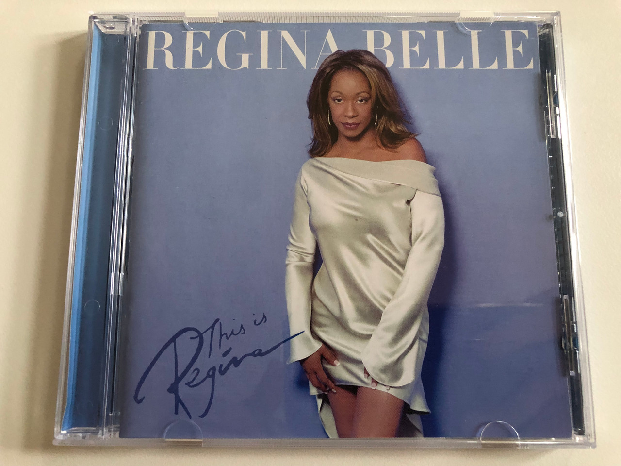 https://cdn10.bigcommerce.com/s-62bdpkt7pb/products/0/images/189673/Regina_Belle_This_Is_Regina_Peak_Records_Audio_CD_2001_PKD-8505-2_1__93131.1630431474.1280.1280.JPG?c=2&_gl=1*noybje*_ga*MjA2NTIxMjE2MC4xNTkwNTEyNTMy*_ga_WS2VZYPC6G*MTYzMDQyOTc5Mi41NC4xLjE2MzA0MzEwNTMuNTE.