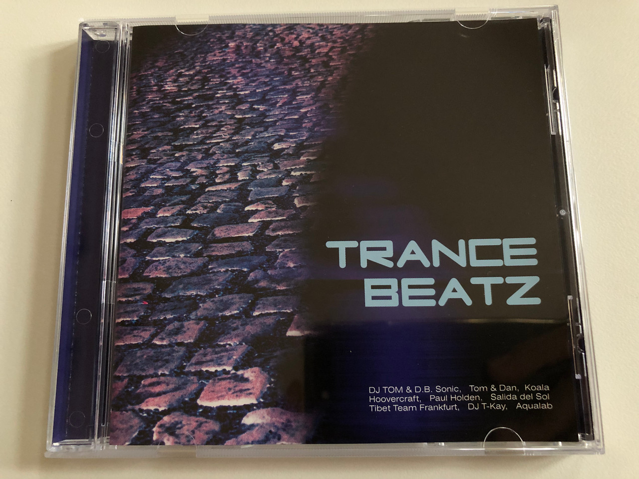https://cdn10.bigcommerce.com/s-62bdpkt7pb/products/0/images/189705/Trance_Beatz_DJ_Tom_D.B._Sonic_Tom_Dan_Koala_Hoovercraft_Paul_Holden_Salida_Del_Sol_Tibet_Team_Frankfurt_DJ_T-Kay_Aqualab_Record_Express_Audio_CD_REC_255144-2_1__08974.1630434099.1280.1280.JPG?c=2&_gl=1*1mymtdl*_ga*MjA2NTIxMjE2MC4xNTkwNTEyNTMy*_ga_WS2VZYPC6G*MTYzMDQyOTc5Mi41NC4xLjE2MzA0MzQxMTguNjA.