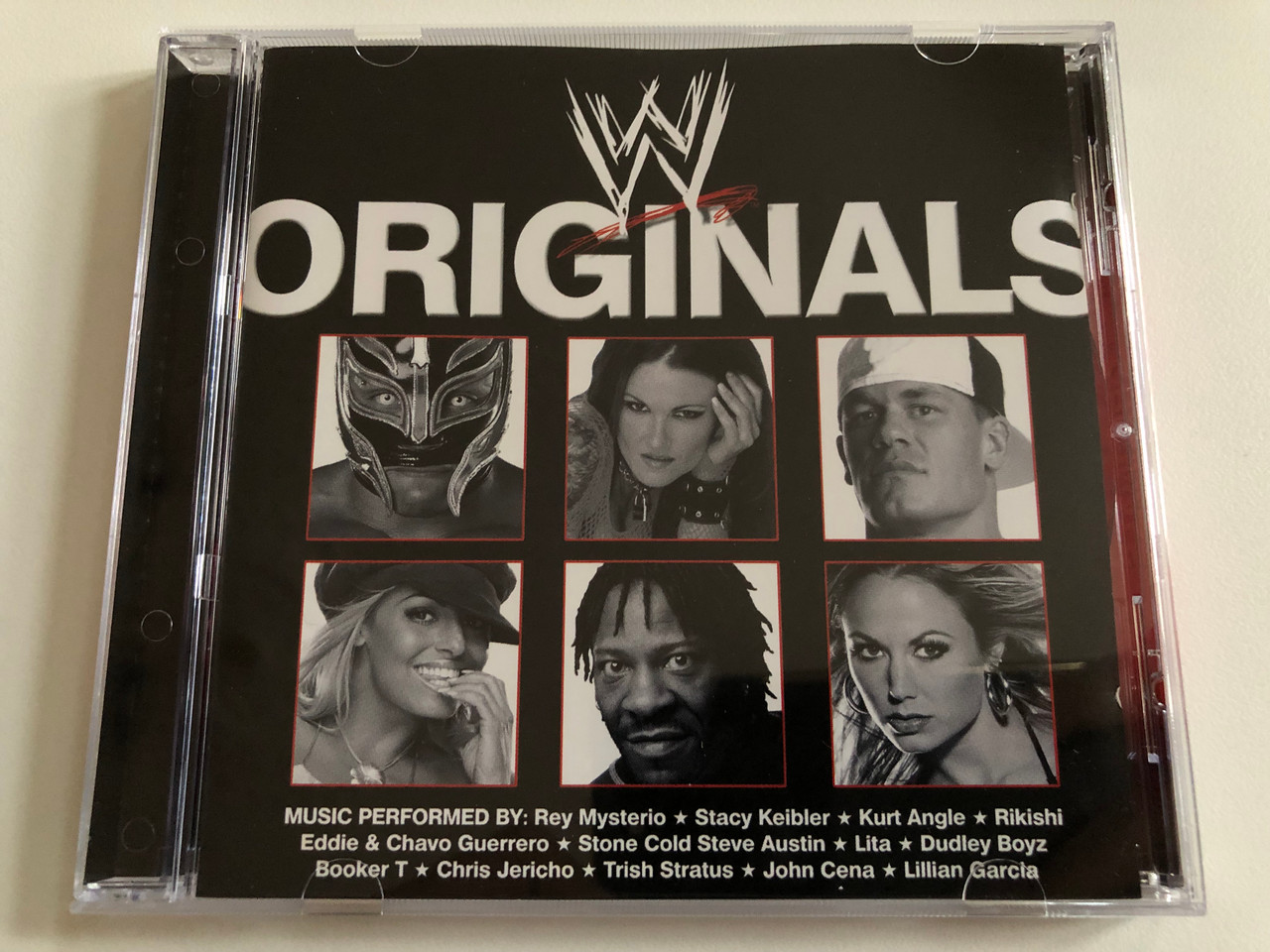 https://cdn10.bigcommerce.com/s-62bdpkt7pb/products/0/images/189740/WWE_Originals_Music_Performed_by_Rey_Mysterio_Stacy_Keibler_Kurt_Angle_Rikishi_Eddie_Chavo_Guerrero_Stone_Cold_Steve_Austin_Lita_Dudley_Boyz_Booker_T_Chris_Jericho_Trish_Stratus_1__94242.1630437618.1280.1280.JPG?c=2&_gl=1*1bi36pf*_ga*MjA2NTIxMjE2MC4xNTkwNTEyNTMy*_ga_WS2VZYPC6G*MTYzMDQyOTc5Mi41NC4xLjE2MzA0MzY0OTEuNTg.