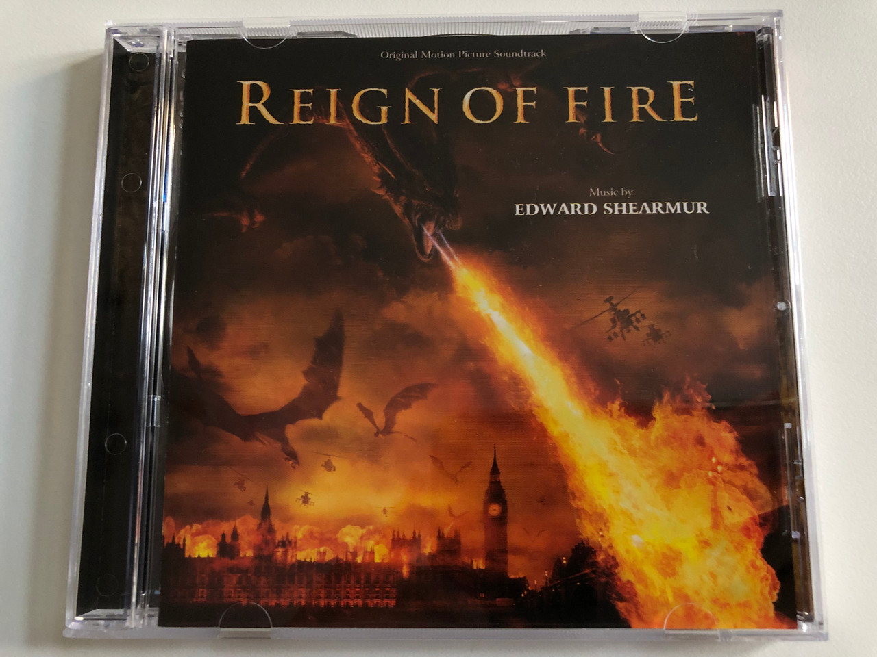 https://cdn10.bigcommerce.com/s-62bdpkt7pb/products/0/images/189772/Reign_Of_Fire_Original_Motion_Picture_Soundtrack_-_Music_by_Edward_Shearmur_Varse_Sarabande_Audio_CD_2002_VSD-6374_1__01810.1630440489.1280.1280.JPG?c=2&_gl=1*htovi7*_ga*MjA2NTIxMjE2MC4xNTkwNTEyNTMy*_ga_WS2VZYPC6G*MTYzMDQyOTc5Mi41NC4xLjE2MzA0NDAyNTEuNTI.