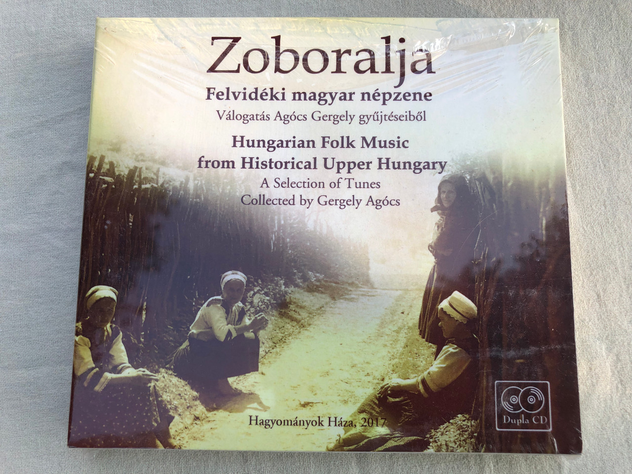 https://cdn10.bigcommerce.com/s-62bdpkt7pb/products/0/images/189792/Zoboralja_Felvidki_Magyar_Npzene_Hungarian_Folk_Music_From_Hungarian_Upper_Hungary_-Vlogats_Agcs_Gergely_Npzenei_Gyjtseibl_A_Selection_Of_Tunes_Hagyomnyok_Hza_2x_Audio_CD_20_1__58571.1630505108.1280.1280.JPG?c=2&_gl=1*gpb8us*_ga*MjA2NTIxMjE2MC4xNTkwNTEyNTMy*_ga_WS2VZYPC6G*MTYzMDUwMzkwMy41NS4xLjE2MzA1MDQ4MDUuNTc.