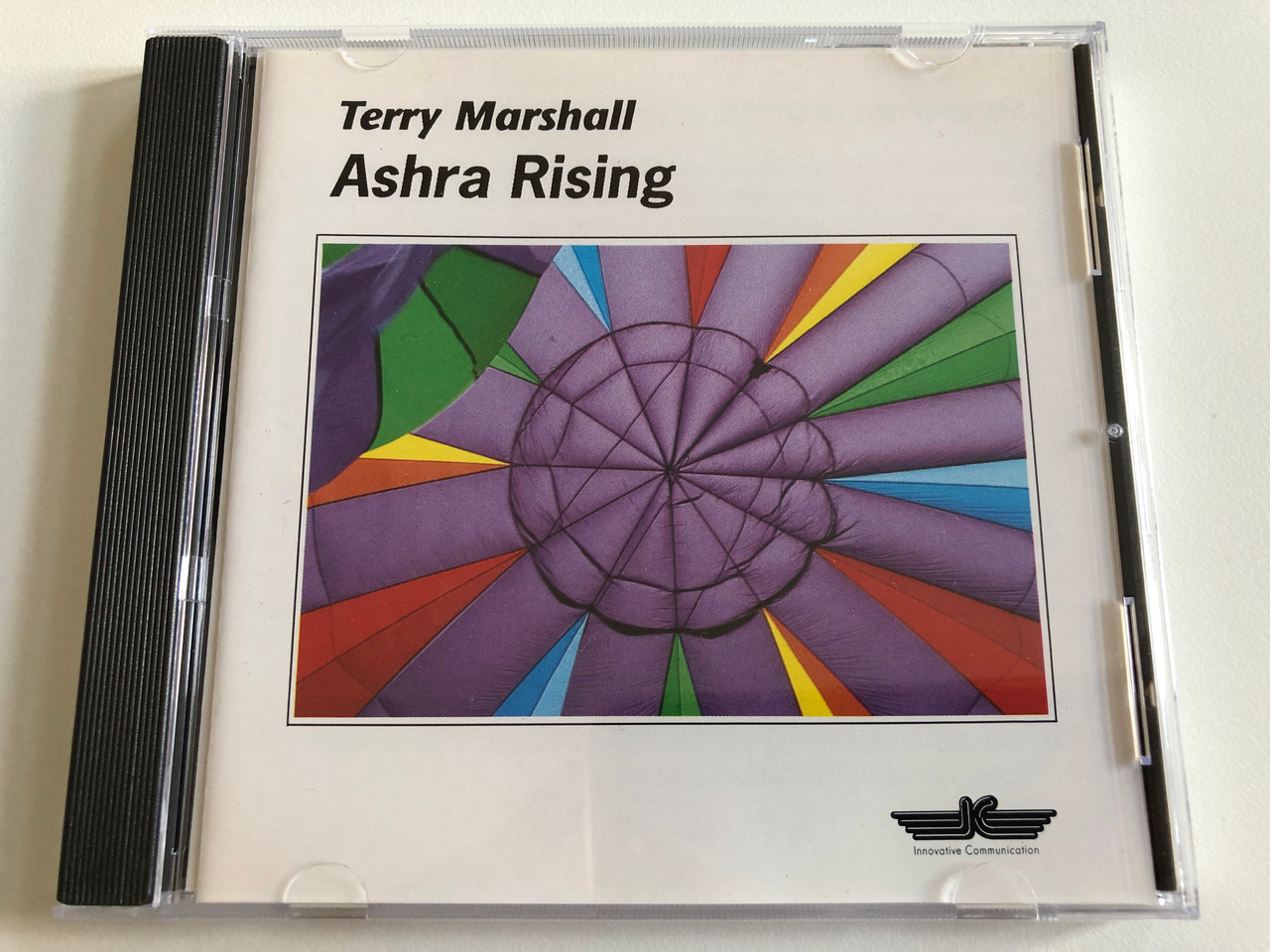 https://cdn10.bigcommerce.com/s-62bdpkt7pb/products/0/images/190030/Terry_Marshall_Ashra_Rising_Innovative_Communication_Audio_CD_1990_Stereo_IC_710_1__32530.1630608399.1280.1280.JPG?c=2&_gl=1*pfvzvn*_ga*MjA2NTIxMjE2MC4xNTkwNTEyNTMy*_ga_WS2VZYPC6G*MTYzMDYwMTA5Mi41OS4xLjE2MzA2MDgyNDMuNDE.