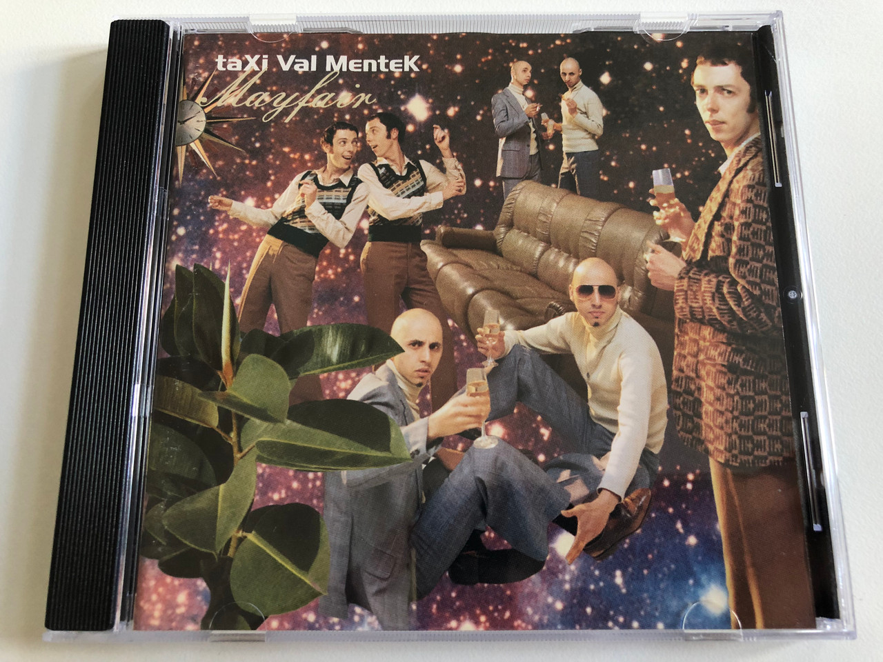 https://cdn10.bigcommerce.com/s-62bdpkt7pb/products/0/images/190045/Taxi_Val_Mentek_Mayfair_RecRec_Music_Audio_CD_1996_ReCDec_73_1__07780.1630609709.1280.1280.JPG?c=2&_gl=1*1h50fsg*_ga*MjA2NTIxMjE2MC4xNTkwNTEyNTMy*_ga_WS2VZYPC6G*MTYzMDYwMTA5Mi41OS4xLjE2MzA2MDk1ODYuMjY.