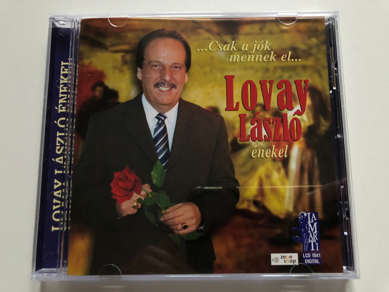 https://cdn10.bigcommerce.com/s-62bdpkt7pb/products/0/images/190302/...Csak_a_jok_mennek_el..._-_Lovay_Laszlo_enekel_LaMarTi_Audio_CD_2007_LCD_1041_1__60241.1630916577.1280.1280.JPG?c=2&_gl=1*f68mgf*_ga*MjA2NTIxMjE2MC4xNTkwNTEyNTMy*_ga_WS2VZYPC6G*MTYzMDkwODcwOC42NS4xLjE2MzA5MTYyNzUuMzI.