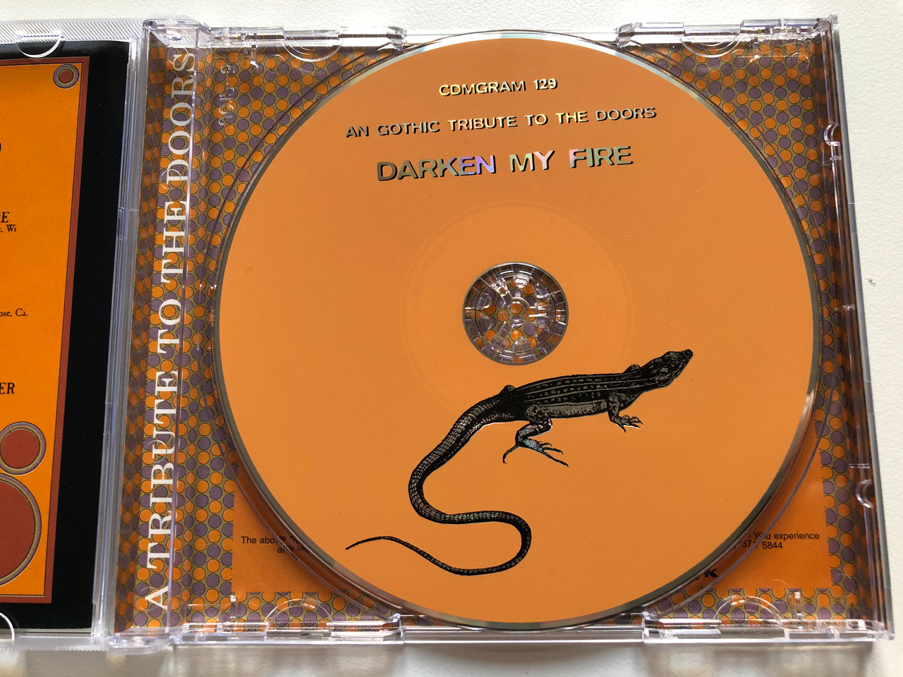 https://cdn10.bigcommerce.com/s-62bdpkt7pb/products/0/images/190482/Darken_My_Fire_-_A_Gothic_Tribute_To_The_Doors_Anagram_Records_Audio_CD_2000_CDMGRAM_129_3__74765.1631020611.1280.1280.JPG?c=2&_gl=1*107iadp*_ga*MjA2NTIxMjE2MC4xNTkwNTEyNTMy*_ga_WS2VZYPC6G*MTYzMTAxOTAzNi42OC4xLjE2MzEwMjA0MzAuMTg.