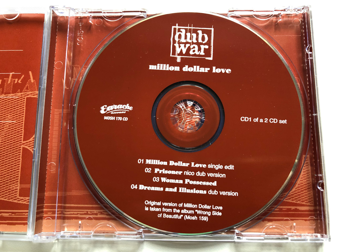 https://cdn10.bigcommerce.com/s-62bdpkt7pb/products/0/images/190581/Dub_War_Million_Dollar_Love_Earache_Audio_CD_1997_MOSH_170_CD_3__51669.1631034231.1280.1280.JPG?c=2&_gl=1*1raf41c*_ga*MjA2NTIxMjE2MC4xNTkwNTEyNTMy*_ga_WS2VZYPC6G*MTYzMTAzMTk0OS42OS4xLjE2MzEwMzQxNDEuNDY.