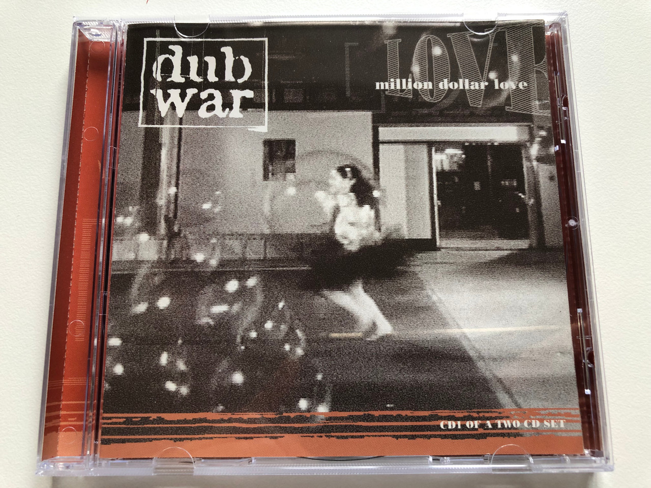 https://cdn10.bigcommerce.com/s-62bdpkt7pb/products/0/images/190583/Dub_War_Million_Dollar_Love_Earache_Audio_CD_1997_MOSH_170_CD_1__59977.1631034232.1280.1280.JPG?c=2&_gl=1*1raf41c*_ga*MjA2NTIxMjE2MC4xNTkwNTEyNTMy*_ga_WS2VZYPC6G*MTYzMTAzMTk0OS42OS4xLjE2MzEwMzQxNDEuNDY.