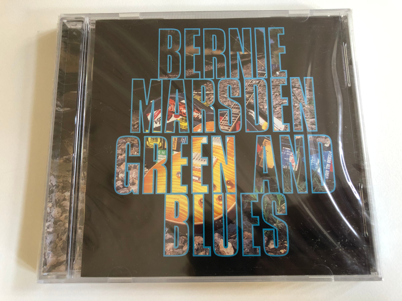 https://cdn10.bigcommerce.com/s-62bdpkt7pb/products/0/images/190709/Bernie_Marsden_Green_And_Blues_Essential_Audio_CD_1995_ESS_CD_324_1__38240.1631117309.1280.1280.JPG?c=2&_gl=1*ukty0x*_ga*MjA2NTIxMjE2MC4xNTkwNTEyNTMy*_ga_WS2VZYPC6G*MTYzMTEwOTIwNC43MS4xLjE2MzExMTczNzMuNjA.