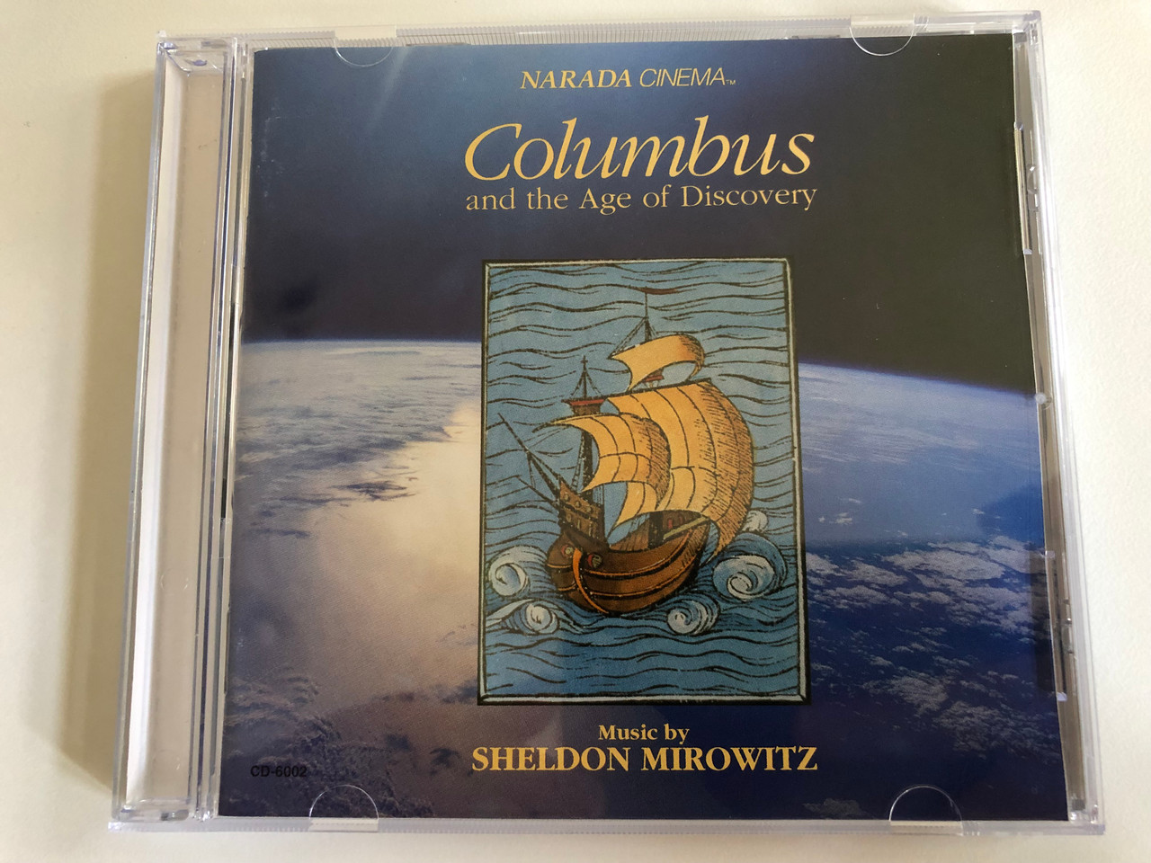 https://cdn10.bigcommerce.com/s-62bdpkt7pb/products/0/images/190740/Columbus_And_The_Age_Of_Discovery_-_Music_by_Sheldon_Mirowitz_Narada_Cinema_Audio_CD_1992_CD-6002G_1__94939.1631123851.1280.1280.JPG?c=2&_gl=1*hq8tlq*_ga*MjA2NTIxMjE2MC4xNTkwNTEyNTMy*_ga_WS2VZYPC6G*MTYzMTEyMjg2NS43Mi4xLjE2MzExMjM4MDkuNjA.