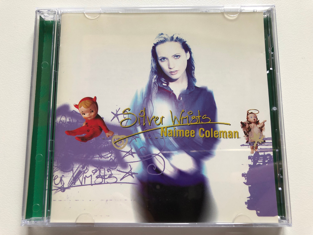 https://cdn10.bigcommerce.com/s-62bdpkt7pb/products/0/images/191152/Silver_Wrists_-_Naimee_Coleman_Lime_Records_Audio_CD_1996_Stereo_724385470127_1__10739.1631517325.1280.1280.JPG?c=2&_gl=1*17kn32i*_ga*MjA2NTIxMjE2MC4xNTkwNTEyNTMy*_ga_WS2VZYPC6G*MTYzMTUxNTA5OC43Ny4xLjE2MzE1MTcwNzQuMg..