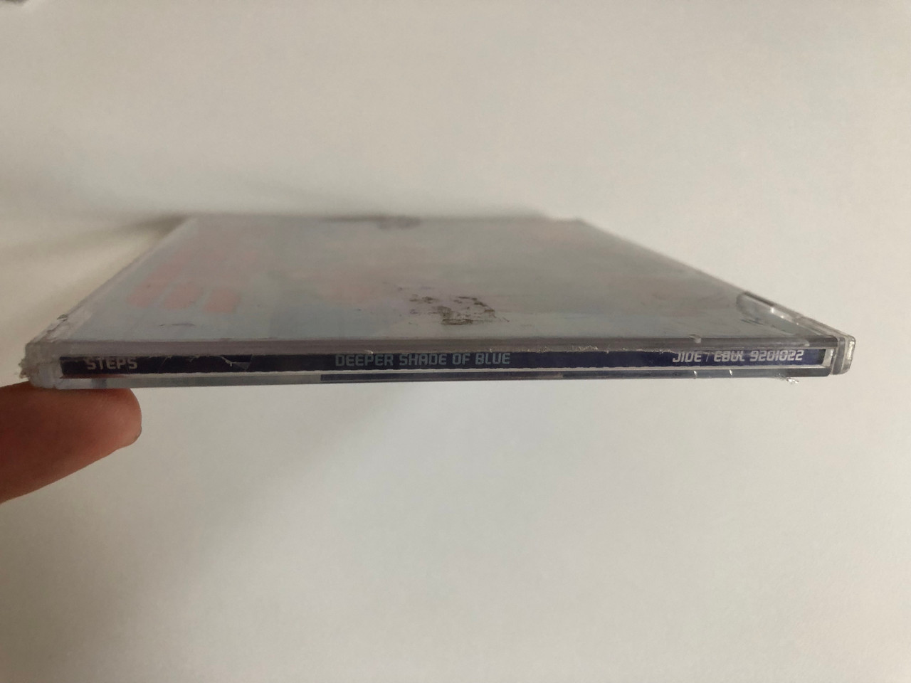 https://cdn10.bigcommerce.com/s-62bdpkt7pb/products/0/images/191270/Steps_Deeper_Shade_Of_Blue_Featuring_The_Full-Leagth_Video_For_Deeper_Shade_Of_Blue_Jive_Audio_CD_2000_9201022_3__61718.1631594629.1280.1280.JPG?c=2&_gl=1*1ywv5e1*_ga*MjA2NTIxMjE2MC4xNTkwNTEyNTMy*_ga_WS2VZYPC6G*MTYzMTU5NDA4MS43OS4xLjE2MzE1OTQ0MTYuMjk.
