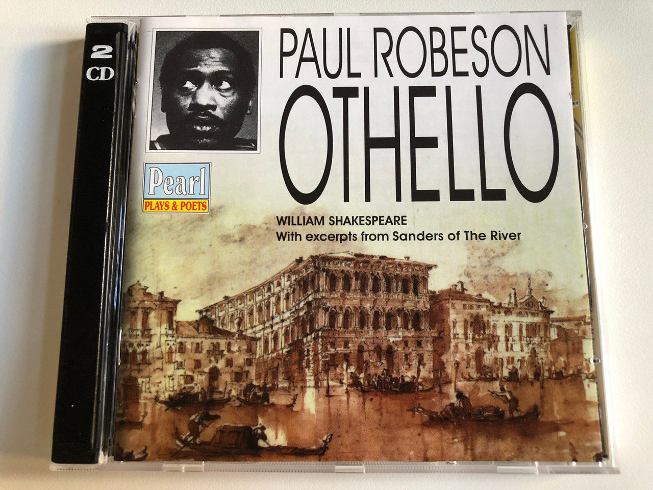 https://cdn10.bigcommerce.com/s-62bdpkt7pb/products/0/images/191925/Paul_Robeson_-_Othello_William_Shakspeare_With_excerpts_from_Sanders_of_The_River_Pearl_Plays_Poets_Audio_CD_1998_Mono_GEMS_0037_1__69820.1632114172.1280.1280.JPG?c=2&_gl=1*1jvccd6*_ga*MjA2NTIxMjE2MC4xNTkwNTEyNTMy*_ga_WS2VZYPC6G*MTYzMjExMDczNi44OS4xLjE2MzIxMTM3NDIuNDA.