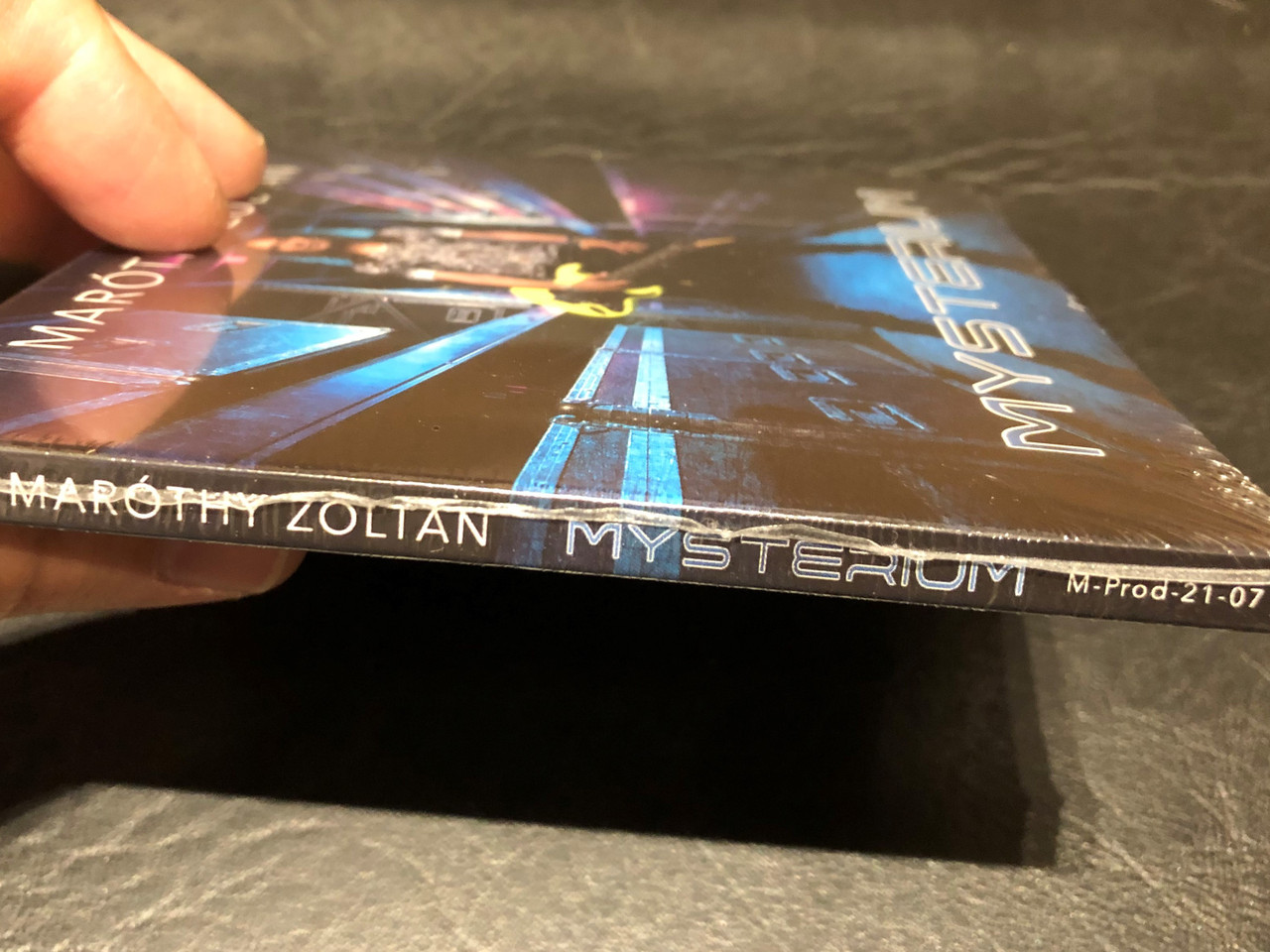 https://cdn10.bigcommerce.com/s-62bdpkt7pb/products/0/images/192218/Marthy_Zoltn_Mysterium_M-Prod_Artist_Kft._Audio_CD_2021_M-Prod-21-07_3__30092.1632204626.1280.1280.JPG?c=2&_gl=1*1hzcon6*_ga*MjA2NTIxMjE2MC4xNTkwNTEyNTMy*_ga_WS2VZYPC6G*MTYzMjIwMTU4My45My4xLjE2MzIyMDQ1OTUuNjA.