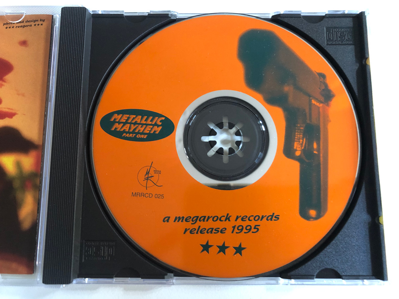 https://cdn10.bigcommerce.com/s-62bdpkt7pb/products/0/images/192476/Metallic_Mayhem_-_Part_One_Over_70_minutes_of_metal_for_the_price_of_a_CD_maxi_single_Megarock_Records_Audio_CD_1995_MRRCD025_3__17551.1632297084.1280.1280.JPG?c=2&_gl=1*1j8smuw*_ga*MjA2NTIxMjE2MC4xNTkwNTEyNTMy*_ga_WS2VZYPC6G*MTYzMjI4NzA1MS45NS4xLjE2MzIyOTY2MTkuNTY.