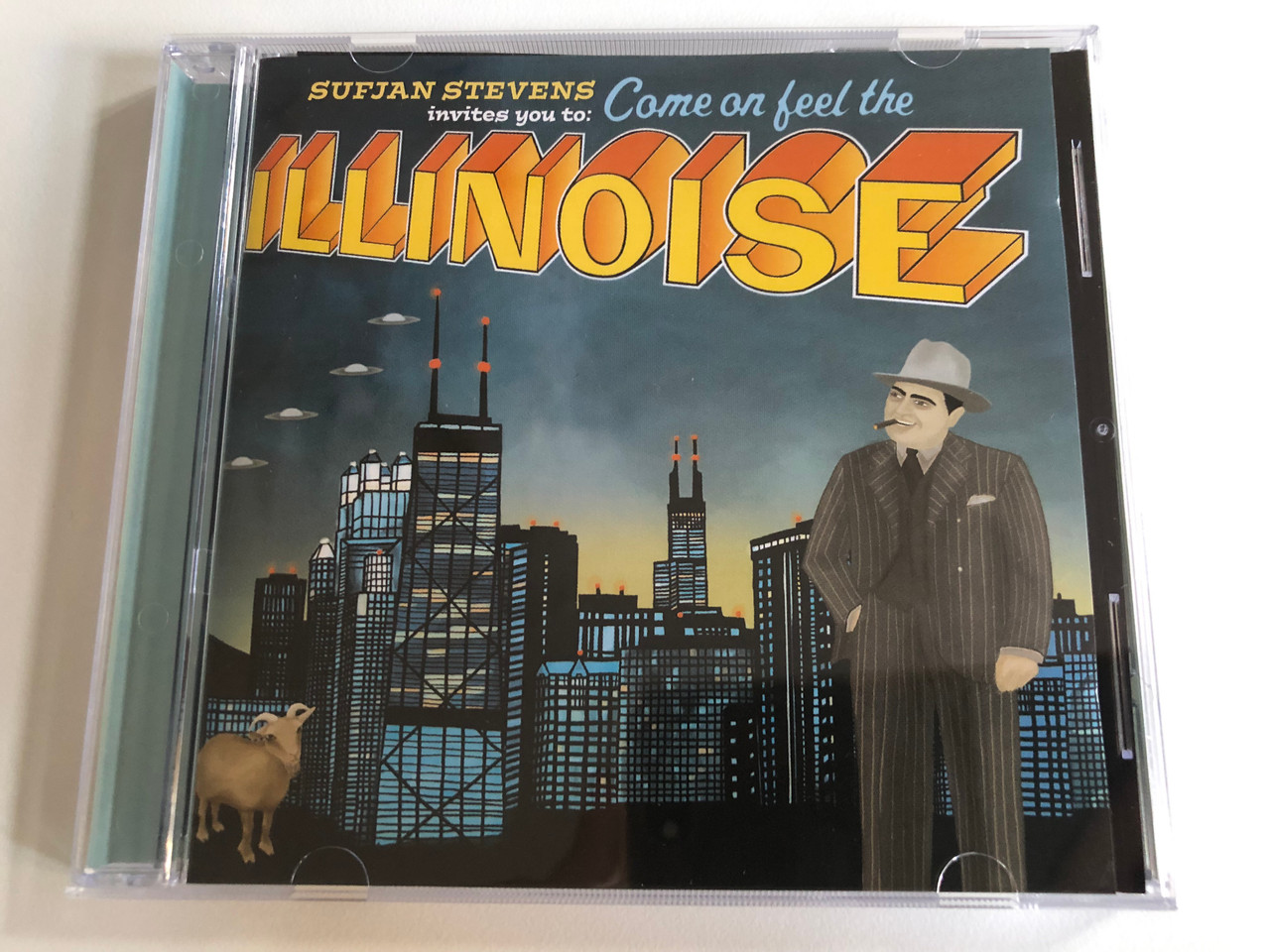 https://cdn10.bigcommerce.com/s-62bdpkt7pb/products/0/images/192534/Sufjan_Stevens_Invites_you_to_Come_on_feel_the_-_Illinoise_Rough_Trade_Audio_CD_2005_RTRADCD250_1__58907.1632303717.1280.1280.JPG?c=2&_gl=1*ho7kpg*_ga*MjA2NTIxMjE2MC4xNTkwNTEyNTMy*_ga_WS2VZYPC6G*MTYzMjI4NzA1MS45NS4xLjE2MzIzMDM0MTAuMzc.