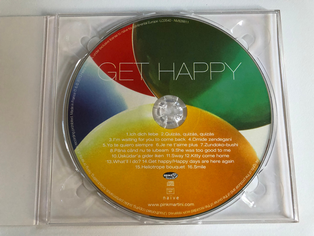 https://cdn10.bigcommerce.com/s-62bdpkt7pb/products/0/images/192591/Pink_Martini_Get_Happy_Nave_Audio_CD_2013_NV828811_3__46685.1632381488.1280.1280.JPG?c=2&_gl=1*zufaz7*_ga*MjA2NTIxMjE2MC4xNTkwNTEyNTMy*_ga_WS2VZYPC6G*MTYzMjM3OTQ5Ni45Ni4xLjE2MzIzODA3MTAuNTc.