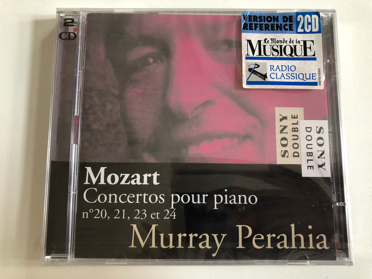 https://cdn10.bigcommerce.com/s-62bdpkt7pb/products/0/images/192687/Mozart_-_Concertos_Pour_Piano_N_20_21_23_et_24_Murray_Perahia_Sony_Double_Sony_Classical_2x_Audio_CD_2000_SM2K89317_1__71638.1632395303.1280.1280.JPG?c=2&_gl=1*1wedrch*_ga*MjA2NTIxMjE2MC4xNTkwNTEyNTMy*_ga_WS2VZYPC6G*MTYzMjM3OTQ5Ni45Ni4xLjE2MzIzOTUxODQuMzQ.
