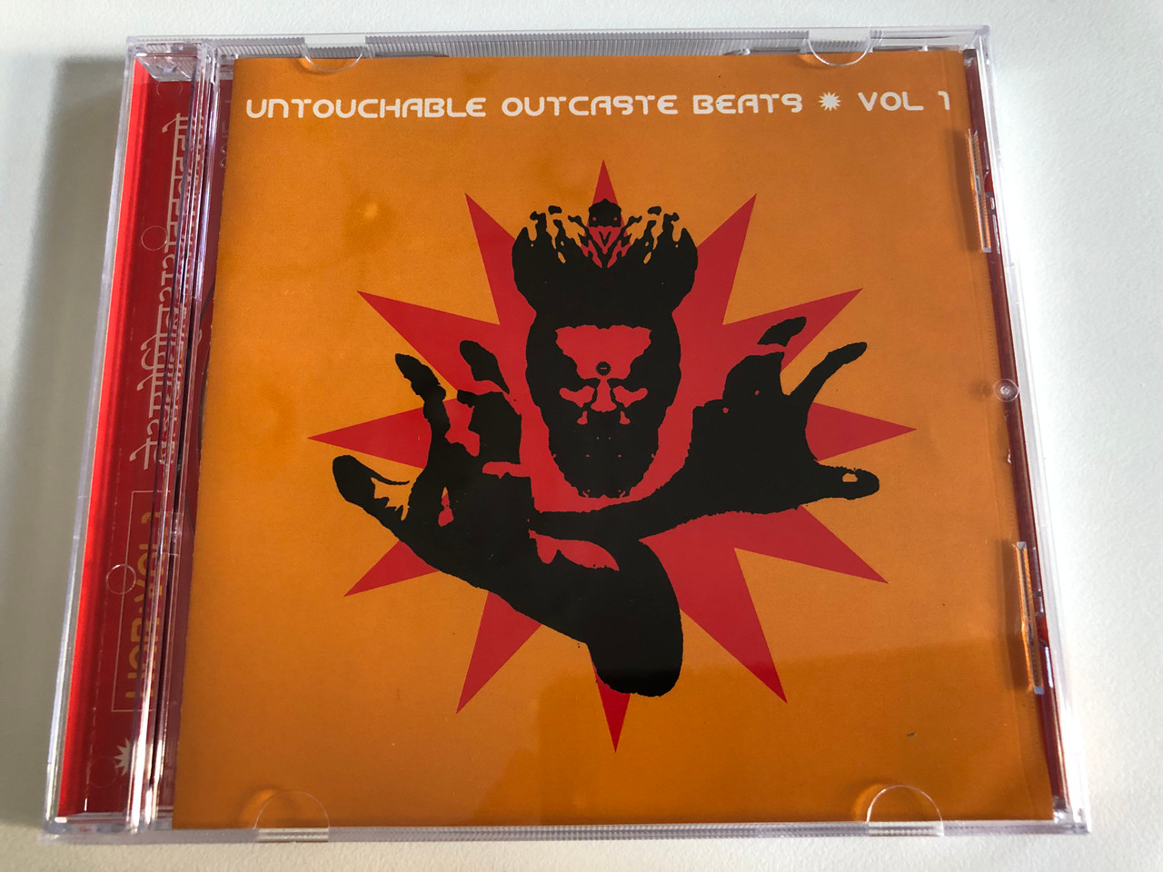 https://cdn10.bigcommerce.com/s-62bdpkt7pb/products/0/images/192821/Untouchable_Outcaste_Beats_-_Vol_1_Outcaste_Records_Audio_CD_1998_CASTE3CD_1__32383.1632479124.1280.1280.JPG?c=2&_gl=1*ctqgd6*_ga*MjA2NTIxMjE2MC4xNTkwNTEyNTMy*_ga_WS2VZYPC6G*MTYzMjQ3NzAwNi45OC4xLjE2MzI0Nzg4OTcuNTY.