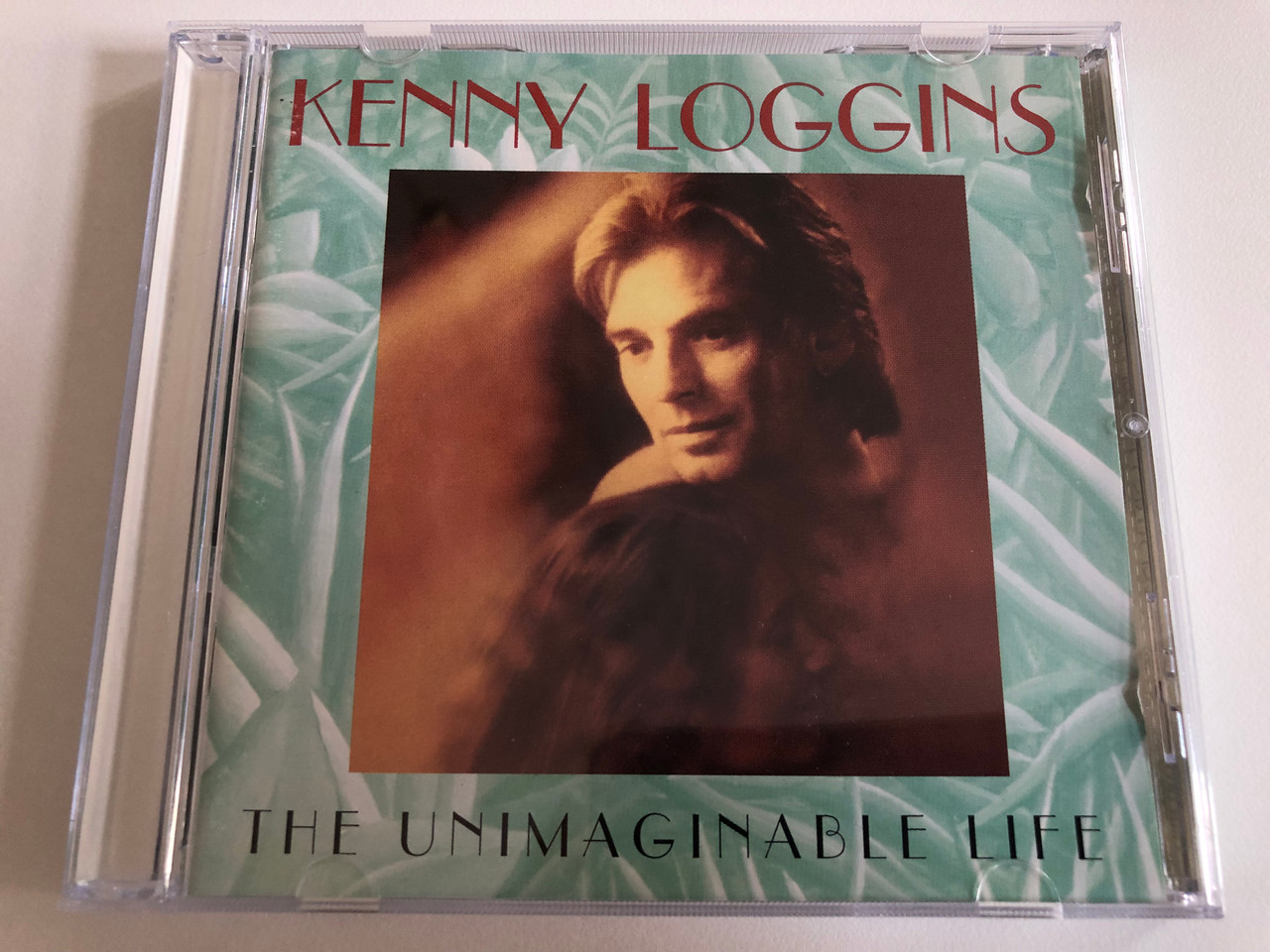 https://cdn10.bigcommerce.com/s-62bdpkt7pb/products/0/images/192935/Kenny_Loggins_-_The_Unimaginable_Life_Columbia_Audio_CD_1997_487809_2_1__75256.1632734889.1280.1280.JPG?c=2&_gl=1*rafi5n*_ga*MjA2NTIxMjE2MC4xNTkwNTEyNTMy*_ga_WS2VZYPC6G*MTYzMjczMzIxOC45OS4xLjE2MzI3MzQ2NjkuNTg.