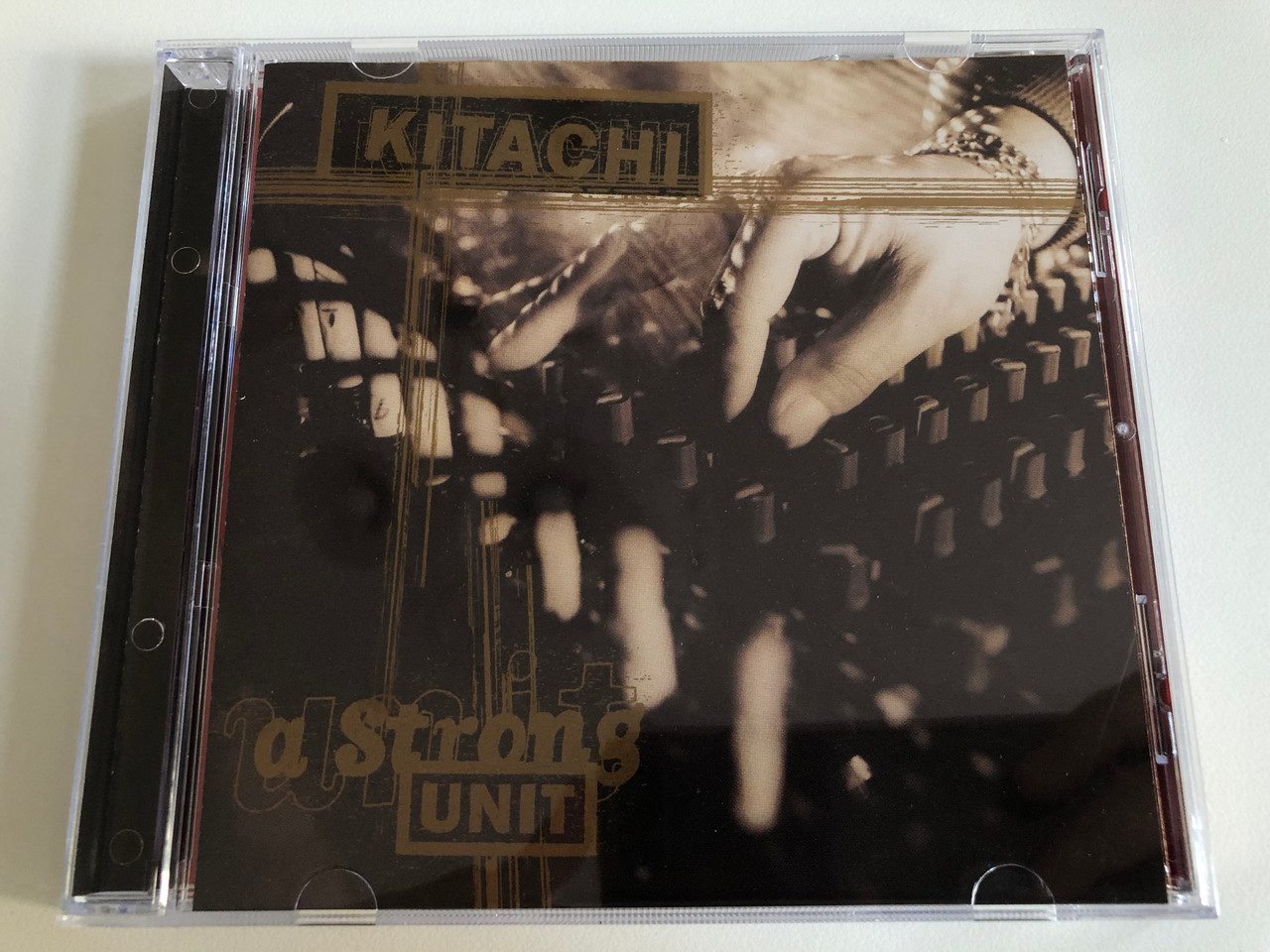https://cdn10.bigcommerce.com/s-62bdpkt7pb/products/0/images/192989/Kitachi_A_Strong_Unit_Dope_On_Plastic_Audio_CD_1996_DOPCD004_1__18671.1632740196.1280.1280.JPG?c=2&_gl=1*1406msr*_ga*MjA2NTIxMjE2MC4xNTkwNTEyNTMy*_ga_WS2VZYPC6G*MTYzMjczMzIxOC45OS4xLjE2MzI3Mzk3MTAuNDQ.