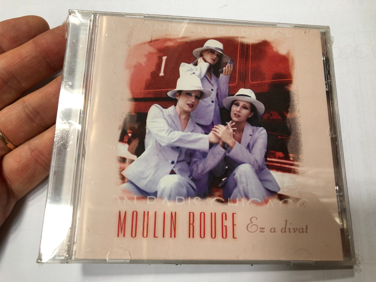 https://cdn10.bigcommerce.com/s-62bdpkt7pb/products/0/images/193155/Moulin_Rouge_-_Ez_a_divat_Family_Records_Audio_CD_2002_FAM_2002012_1__12837.1632822851.1280.1280.JPG?c=2&_gl=1*if9ymw*_ga*MjA2NTIxMjE2MC4xNTkwNTEyNTMy*_ga_WS2VZYPC6G*MTYzMjgxNzM2My4xMDIuMS4xNjMyODIyNTE0LjU4