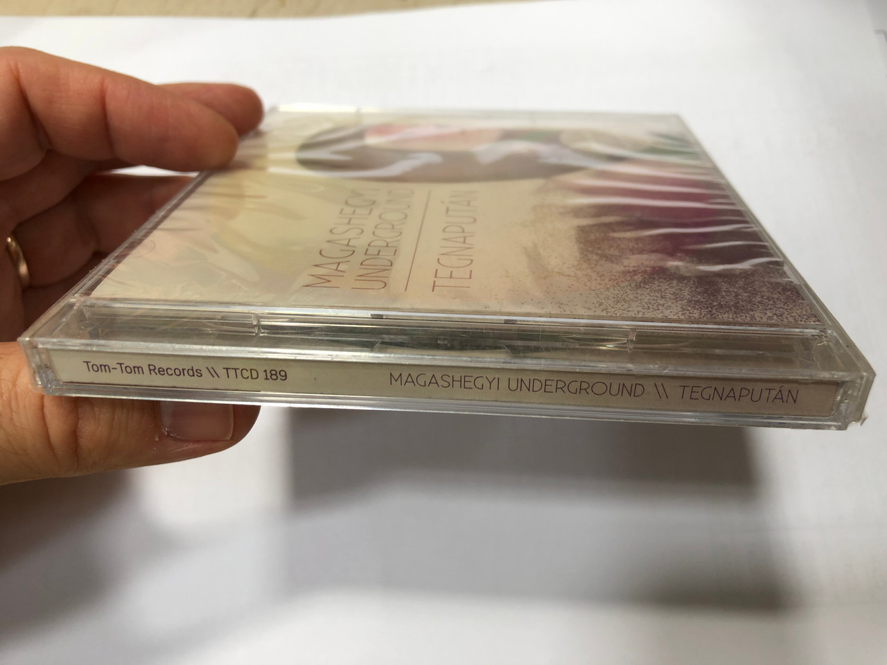 https://cdn10.bigcommerce.com/s-62bdpkt7pb/products/0/images/193156/Magashegyi_Underground_Tegnaputn_Szimfonikus_DVD_melleklettel_Tom-Tom_Records_Audio_CD_DVD_Video_2013_TTCD_189_3__95582.1632823233.1280.1280.JPG?c=2&_gl=1*aeki49*_ga*MjA2NTIxMjE2MC4xNTkwNTEyNTMy*_ga_WS2VZYPC6G*MTYzMjgxNzM2My4xMDIuMS4xNjMyODIzMTE0LjQy