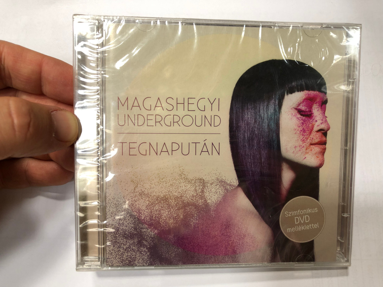 https://cdn10.bigcommerce.com/s-62bdpkt7pb/products/0/images/193157/Magashegyi_Underground_Tegnaputn_Szimfonikus_DVD_melleklettel_Tom-Tom_Records_Audio_CD_DVD_Video_2013_TTCD_189_1__34473.1632823234.1280.1280.JPG?c=2&_gl=1*aeki49*_ga*MjA2NTIxMjE2MC4xNTkwNTEyNTMy*_ga_WS2VZYPC6G*MTYzMjgxNzM2My4xMDIuMS4xNjMyODIzMTE0LjQy