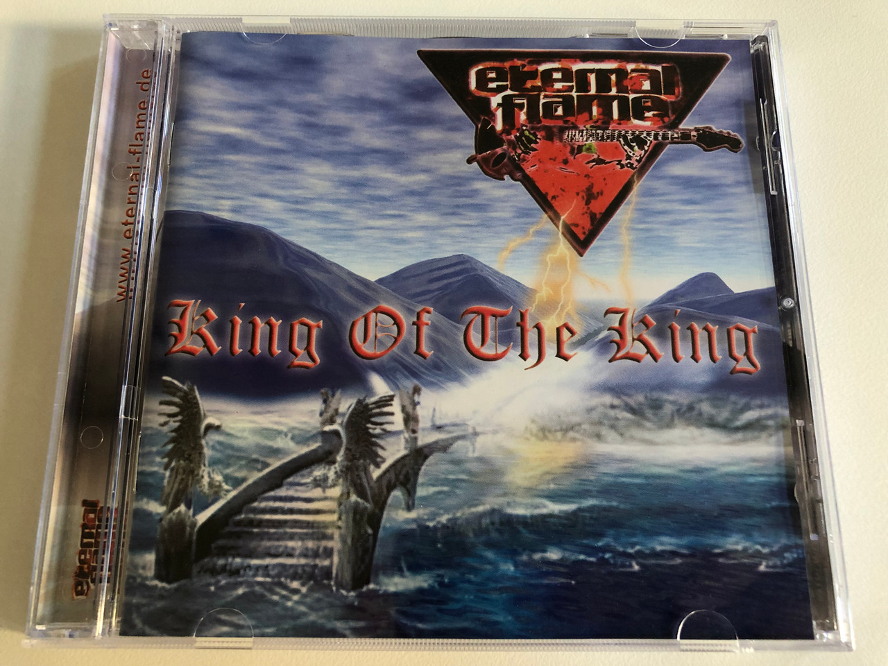 https://cdn10.bigcommerce.com/s-62bdpkt7pb/products/0/images/193182/Eternal_Flame_King_Of_The_King_MTM_Music_Audio_CD_2002_0681-53_1__53660.1632827020.1280.1280.JPG?c=2&_gl=1*1jdcqql*_ga*MjA2NTIxMjE2MC4xNTkwNTEyNTMy*_ga_WS2VZYPC6G*MTYzMjgxNzM2My4xMDIuMS4xNjMyODI2ODU2LjUx