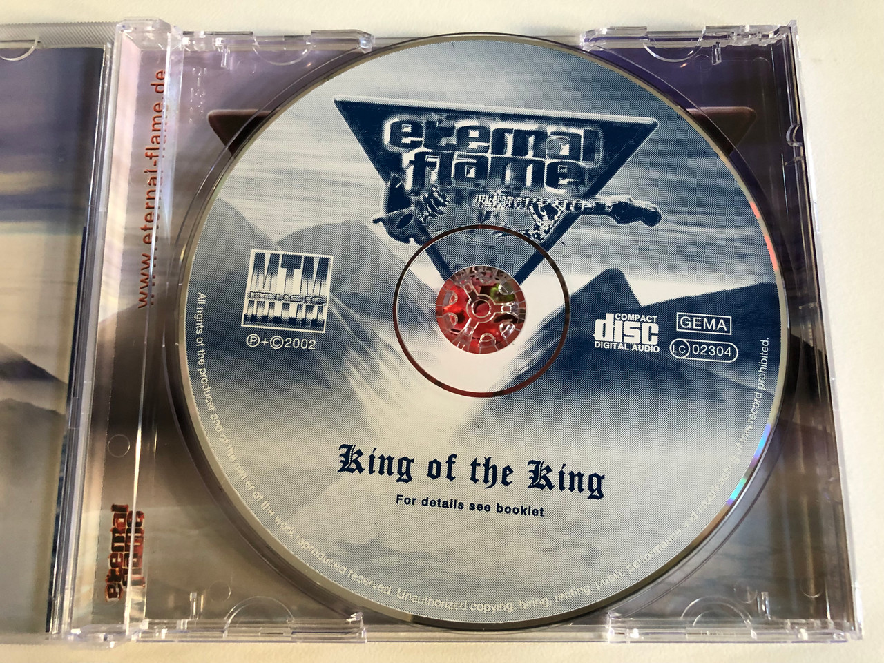 https://cdn10.bigcommerce.com/s-62bdpkt7pb/products/0/images/193187/Eternal_Flame_King_Of_The_King_MTM_Music_Audio_CD_2002_0681-53_3__35405.1632827022.1280.1280.JPG?c=2&_gl=1*1jdcqql*_ga*MjA2NTIxMjE2MC4xNTkwNTEyNTMy*_ga_WS2VZYPC6G*MTYzMjgxNzM2My4xMDIuMS4xNjMyODI2ODU2LjUx