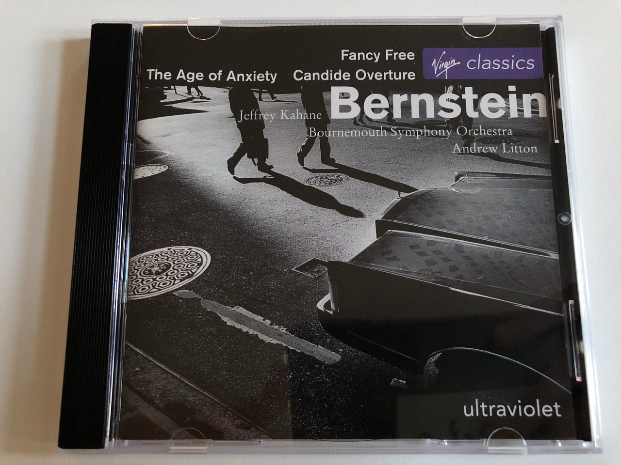 https://cdn10.bigcommerce.com/s-62bdpkt7pb/products/0/images/193883/Fancy_Free_The_Age_Of_Anxiety_Candide_Overture_-_Bernstein_Jeffrey_Kahane_Bournemouth_Symphony_Orchestra_Andrew_Litton_Ultraviolet_Virgin_Classics_Audio_CD_1998_724356111929_1__37701.1633109904.1280.1280.JPG?c=2&_gl=1*2cmq2*_ga*MjA2NTIxMjE2MC4xNTkwNTEyNTMy*_ga_WS2VZYPC6G*MTYzMzA5ODY0Mi4xMTAuMS4xNjMzMTA5NTkyLjYw