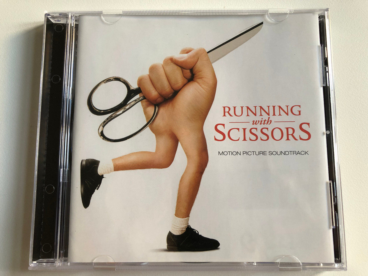 https://cdn10.bigcommerce.com/s-62bdpkt7pb/products/0/images/194133/Running_With_Scissors_Motion_Picture_Soundtrack_EMI_Audio_CD_2006_09463-71841-2-7_1__33933.1633415494.1280.1280.JPG?c=2&_gl=1*11cpny*_ga*MjA2NTIxMjE2MC4xNTkwNTEyNTMy*_ga_WS2VZYPC6G*MTYzMzQxMjA1Ny4xMTQuMS4xNjMzNDE1Mzc5LjMy