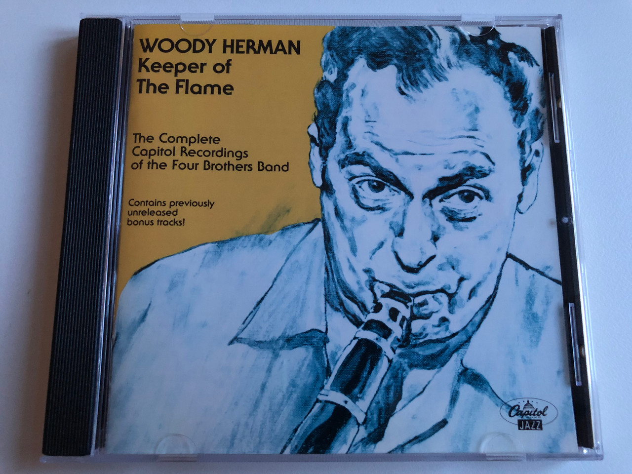 https://cdn10.bigcommerce.com/s-62bdpkt7pb/products/0/images/194881/Woody_Herman_Keeper_Of_The_Flame_The_Complete_Capitol_Recordings_Of_The_Four_Brothers_Band_Contains_previously_unreleased_bonus_tracks_Capitol_Jazz_Audio_CD_1992_CDP_7_98453_2_1__60351.1633688541.1280.1280.JPG?c=2&_gl=1*1vqvo99*_ga*MjA2NTIxMjE2MC4xNTkwNTEyNTMy*_ga_WS2VZYPC6G*MTYzMzY3NDQ0My4xMjAuMS4xNjMzNjg4Mzc2LjUx