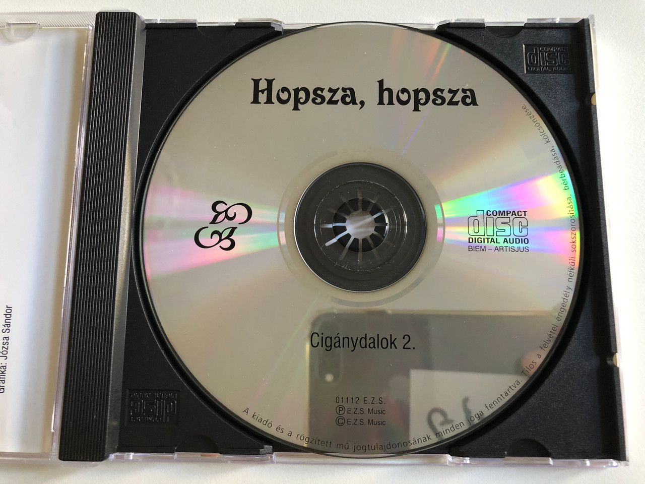 https://cdn10.bigcommerce.com/s-62bdpkt7pb/products/0/images/195427/Hopsza_hopsza_-_Ciganydalok_2._E._Z._S._Music_Audio_CD_01112_E._Z._S_3__03150.1634058980.1280.1280.JPG?c=2&_gl=1*j4bsa0*_ga*MjA2NTIxMjE2MC4xNTkwNTEyNTMy*_ga_WS2VZYPC6G*MTYzNDA1Njg1OC4xMjQuMS4xNjM0MDU4NzUzLjc.