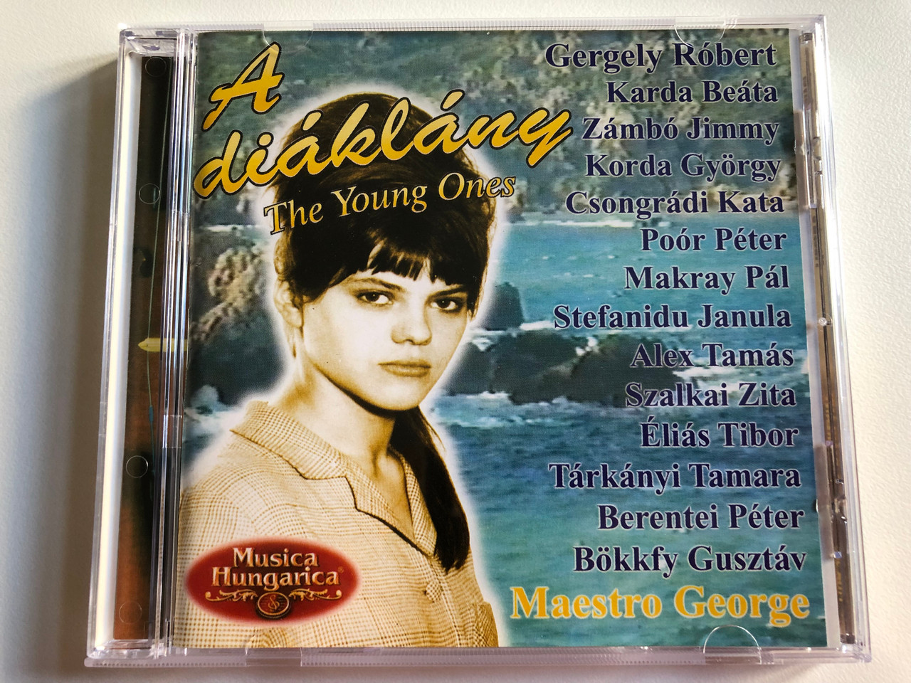 https://cdn10.bigcommerce.com/s-62bdpkt7pb/products/0/images/195493/A_diaklany_-_The_Young_Ones_-_Maestro_George_Gergely_Robert_Karda_Beata_Zambo_Jimmy_Korda_Gyorgy_Csongradi_Kata_Poor_Peter_Makray_Pal_Stefanidu_Janula_Alex_Tamas_Szalkai_Zita_Elias_1__38179.1634104621.1280.1280.JPG?c=2&_gl=1*1e5ylrm*_ga*MjA2NTIxMjE2MC4xNTkwNTEyNTMy*_ga_WS2VZYPC6G*MTYzNDA5OTIwNy4xMjUuMS4xNjM0MTA0MjMxLjUx