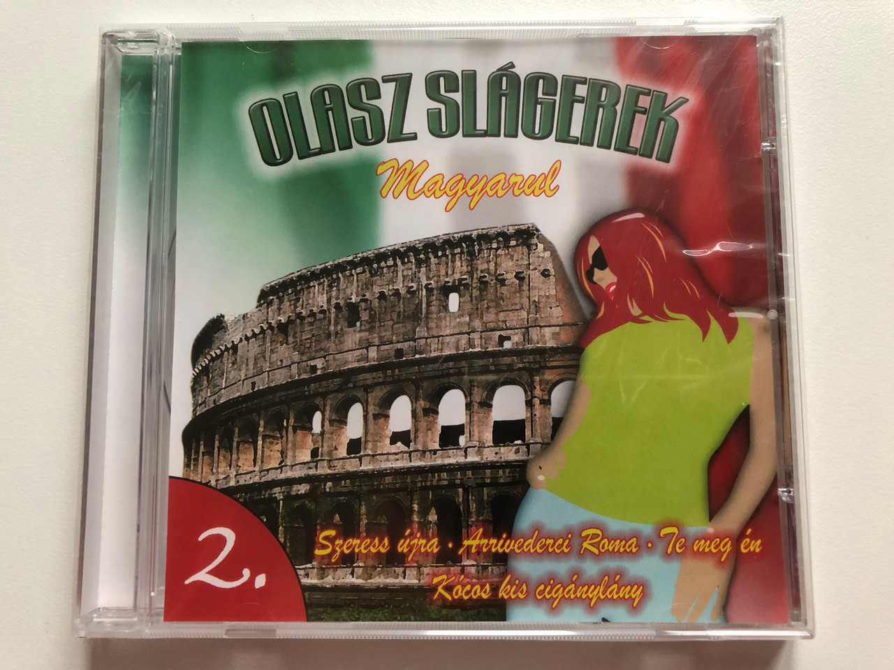 https://cdn10.bigcommerce.com/s-62bdpkt7pb/products/0/images/196289/Olasz_Slogerek_-_Magyarul_-_2._Szeress_ujra_Arrivederci_Roma_Te_meg_en_Kocos_kis_ciganylany_Art_Media_Audio_CD_71042_RNR_1__27974.1634662836.1280.1280.JPG?c=2&_gl=1*1jbv6cl*_ga*MjA2NTIxMjE2MC4xNTkwNTEyNTMy*_ga_WS2VZYPC6G*MTYzNDY1NzY0NS4xMzIuMS4xNjM0NjYyNDQ4LjQw