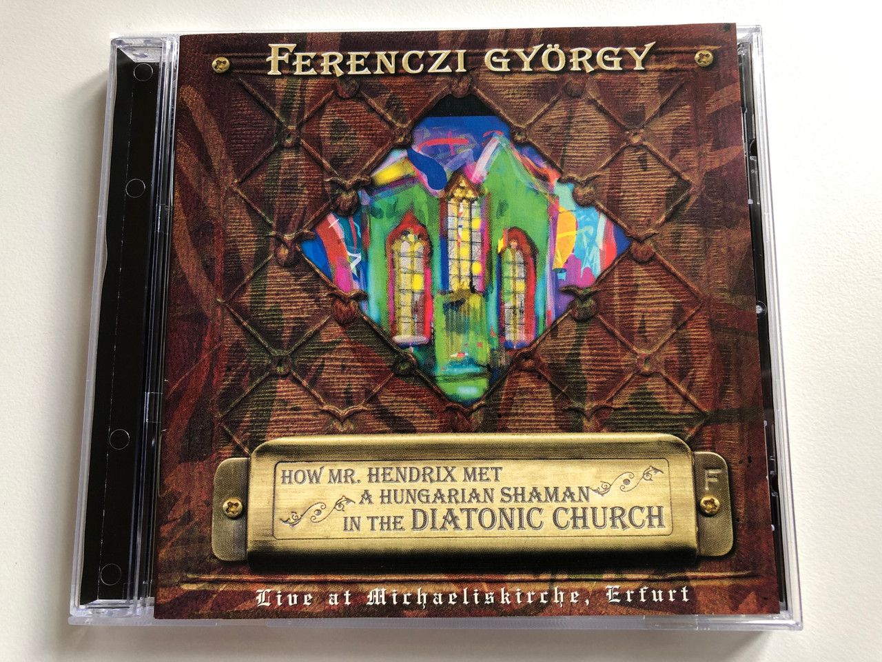 https://cdn10.bigcommerce.com/s-62bdpkt7pb/products/0/images/196320/Ferenczi_Gyrgy_HOW_MR._HENDRIX_MET_A_HUNGARIAN_SHAMAN_IN_THE_DIATONIC_CHURCH_Live_At_Michaeliskirche_Erfurt_Gryllus_Audio_CD_2005_GCD_039_1__06709.1634666021.1280.1280.JPG?c=2&_gl=1*jn6uuy*_ga*MjA2NTIxMjE2MC4xNTkwNTEyNTMy*_ga_WS2VZYPC6G*MTYzNDY1NzY0NS4xMzIuMS4xNjM0NjY1NzU5LjE.